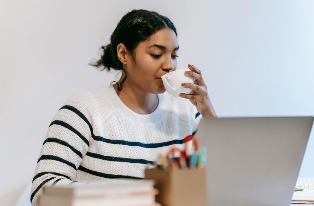 Woman working on laptop at desk
