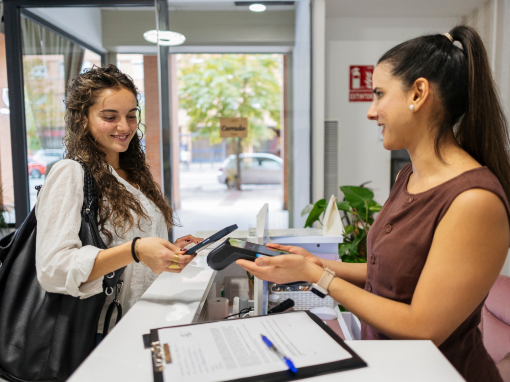 Wedding business owner takes card payment for deposit from bride